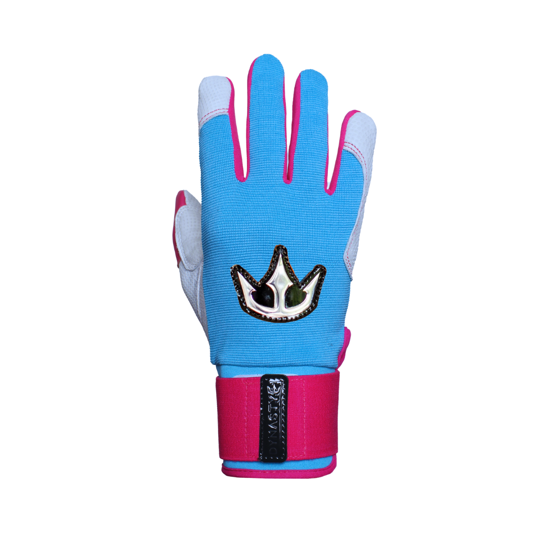 A single batting glove displayed, with one glove showing the back of the glove. The glove is primarily white with blue and pink accents. The back of the left glove features a blue section with a crown-like emblem. The glove has pink trim along the fingers and a pink wrist strap with a black patch.