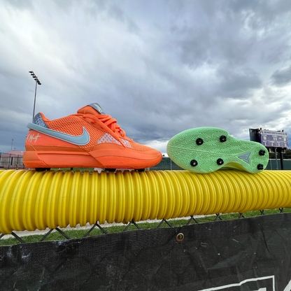 Fully installed Yardkick cleats on a fence at a baseball field