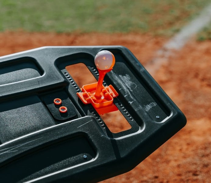 The mini training ball tee topper attached to the Perfect Swings USA Swing path trainer and a mini wiffle ball on top